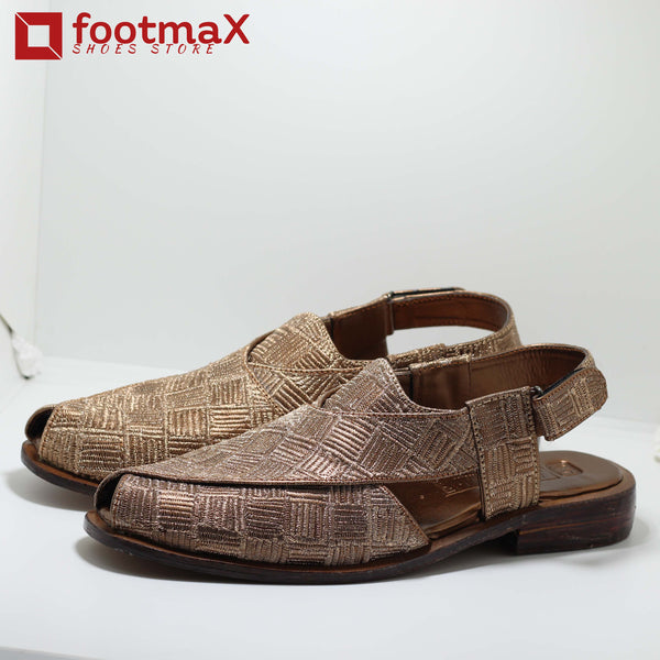 Expertly crafted with traditional embroidery and a luxurious leather upper,